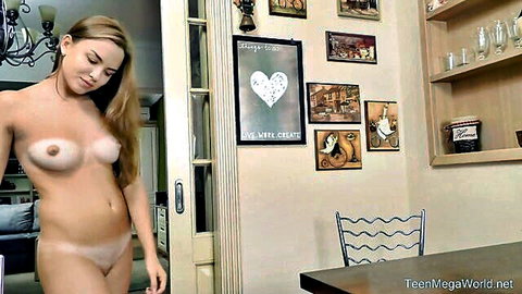 Blonde teen beauty posing topless in sheer panties