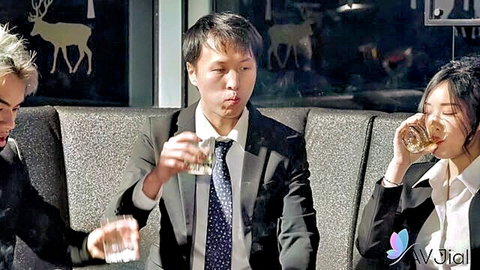 Three suited Asians toasting whiskey glasses in lounge with deer decor