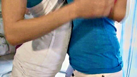 Katia and Daria embracing intimately in tight tops