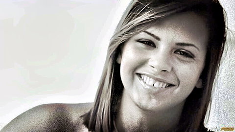 Keisha Grey smiling topless close-up portrait in black and white