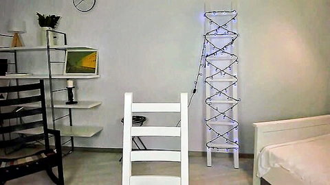 Teen in cozy room setup flashing her body
