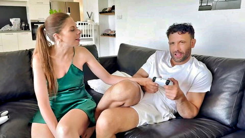 Alice teases gamer Emmanuel in sexy green slip dress