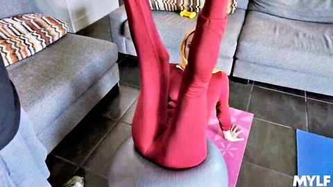 Anissa Kate in tight red bodysuit doing ass-up yoga pose on ball