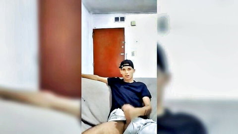 Daring Boyxx solo twink in casual lounge pose
