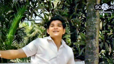 Smiling Desi man in white shirt outdoors, from hot Bhabhi drilled video