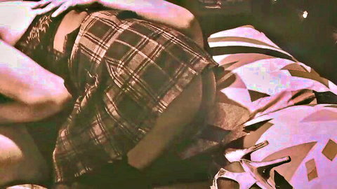 Lesbian couple intimate embrace in plaid skirt and black lingerie