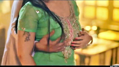 Indian bhabhi in green embroidered saree groped intimately by man in steamy scene