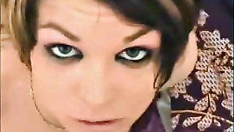 Close-up of green-eyed brunette in intense facial cumshot porn thumbnail