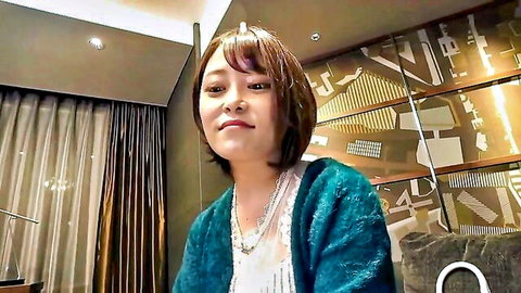 Asian married woman with G-cup boobs smiling seductively
