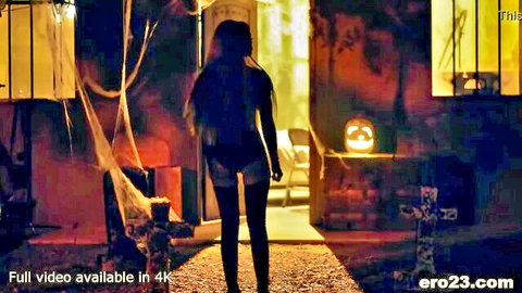 Sexy woman in tiny denim shorts teases round ass walking into haunted Halloween house