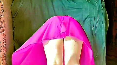 Playful femboy teasing with lifted pink petticoat, exposing white panties