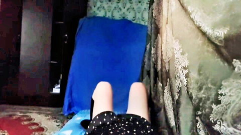 Feminine femboy legs up in short black polka dot dress teasing