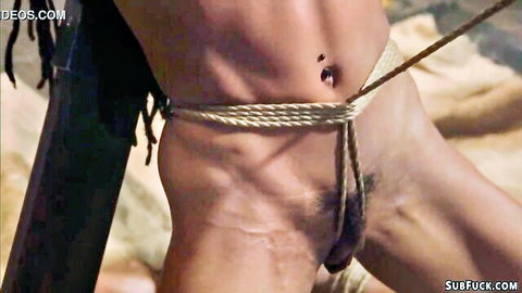 Kira Noir suspended in ropes, crotch bound, nude in BDSM scene