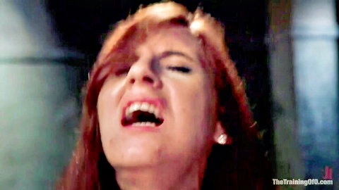 Pretty redhead slave screaming in ecstasy during BDSM training