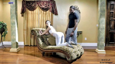 Paige Owens provocative workout pose with black stud in tight white outfit