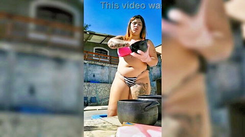 Curvy tattooed woman in bikini teases by pool with oil pot, craving thick cock