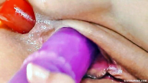 Blonde solo masturbation with purple dildo insertion and red fruit tease