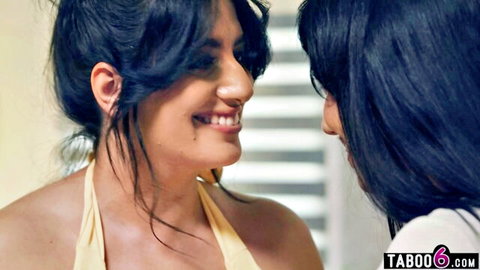 Arab and Latina MILF lesbians smiling intimately in yellow top, close-up tit-to-tit tease
