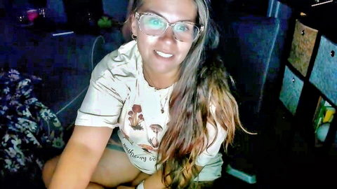 Melchatte camgirl smiling in mushroom t-shirt and glasses, casual pose