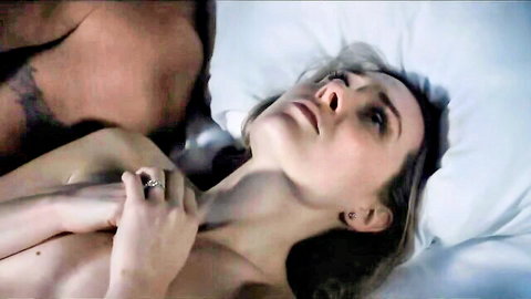 Shelby Handley as Zoe Ellison nude in bed, neck held during intimate scene in Cheat 2024