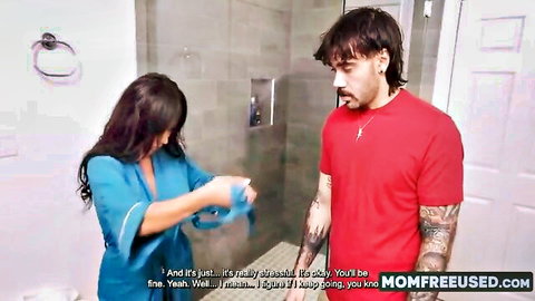 Lena stepmom in blue robe offering body support to tattooed stepson