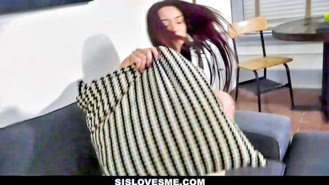 Young brunette stepsister teasing with striped pillow in white top