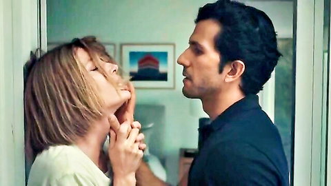 Elizabeth Banks in intimate kissing scene with male actor, close embrace