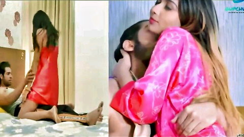 Desi couple in red dress and pink robe passionate embrace
