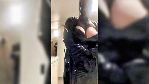 Curvy ebony woman in shiny black PVC coat exposing huge breasts