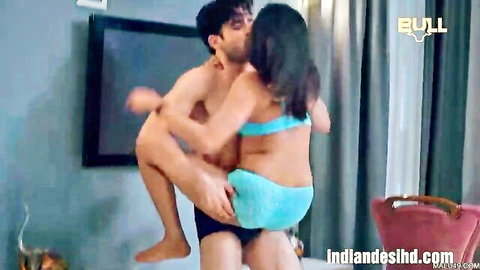 Indian hunk lifts desi babe in blue bikini for passionate kiss groping her ass