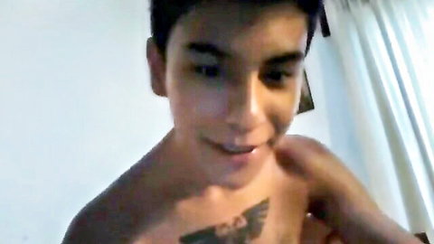 Smiling Latino twink with eagle chest tattoo in webcam show