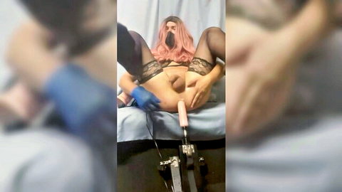 Pink-haired trans in lingerie rides sex machine, gloved insertion