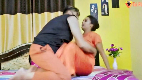 Indian MILF in orange dress passionately fucking in spooning position