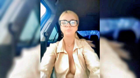 Love_Bri blonde in open blouse showing deep cleavage, car selfie