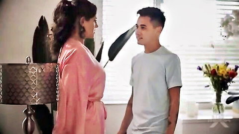 Stepmom Penny in pink robe talking to young stepson