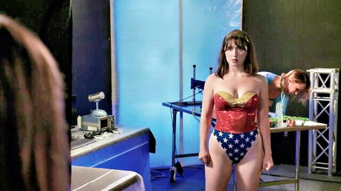 Sexy Wonder Woman cosplay model posing in revealing superhero outfit