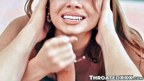 Stella Luxx smiles with hands on face during expert throating blowjob