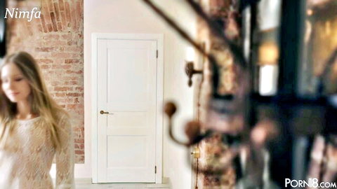 Blonde model Nymph in sheer lacy top approaching door, teasing preview