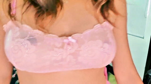 Laura Martinez in pink lace bra showing cleavage