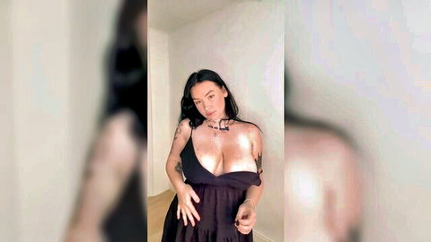 Tattooed big boob Asian teen in low-cut black dress talks dirty