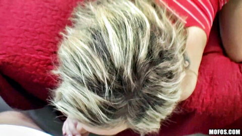 Blonde woman with ecstatic expression in red striped top during anal couple sex