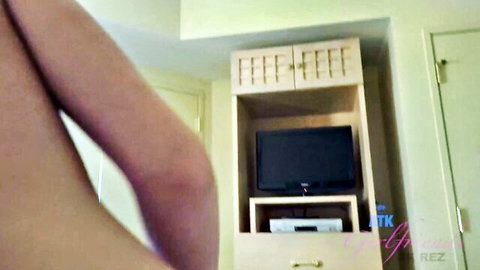 Babe's bare thighs and legs spread wide teasing in bedroom with TV cabinet