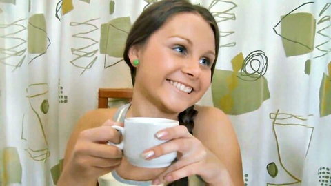 Milla Yul smiling in tank top, holding cup before sensual rubdown
