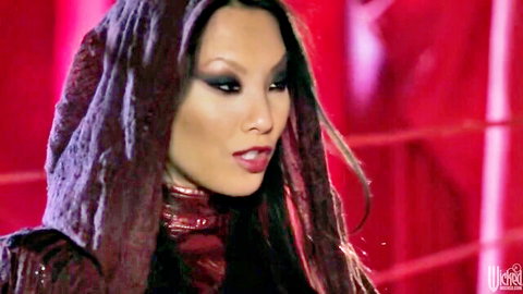Asa Akira seductive close-up in dark hooded robe, Underworld adult scene