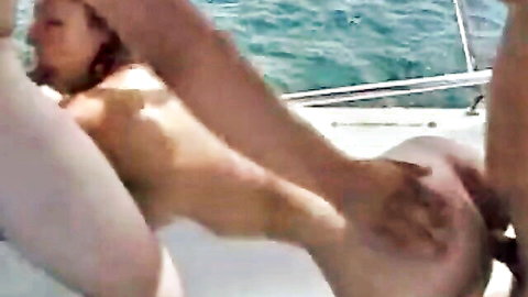 Brunette with natural tits in outdoor boat threesome, doggy style penetration