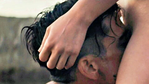 Pale woman's hand grips wet dark-haired man's head pushing his face into her pussy outdoors