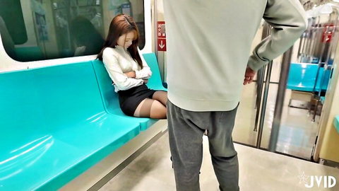 Cute Asian teen in stockings sits on subway seat, man teases from behind