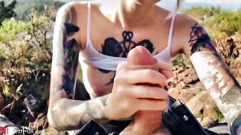 Real Red Fox tattooed babe handjobs cock outdoors in white bra