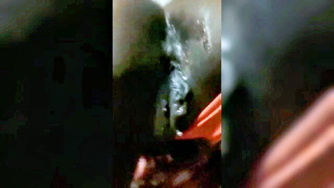 Dark skin thot in explicit shadowy pose, free porn video