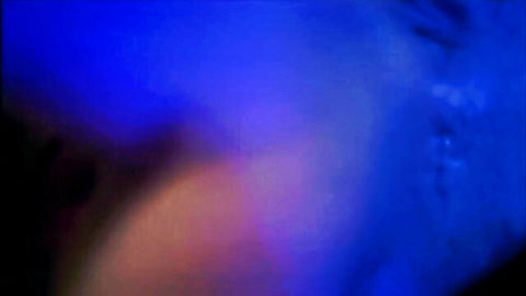 Blurry vintage blonde babe spreads legs and fingers pussy in retro blue-tinted porn scene
